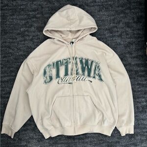 Beige Hoodie with Green Print
